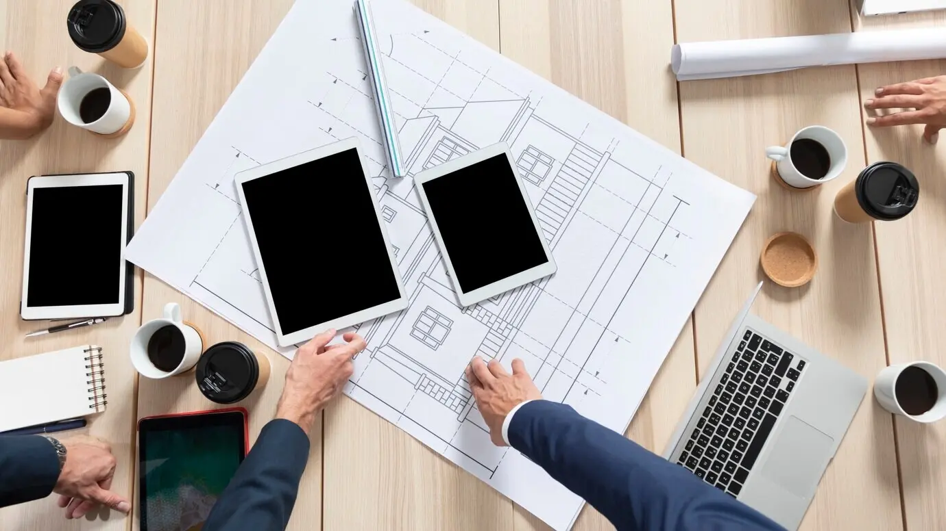 Overhead view of professionals working on a project